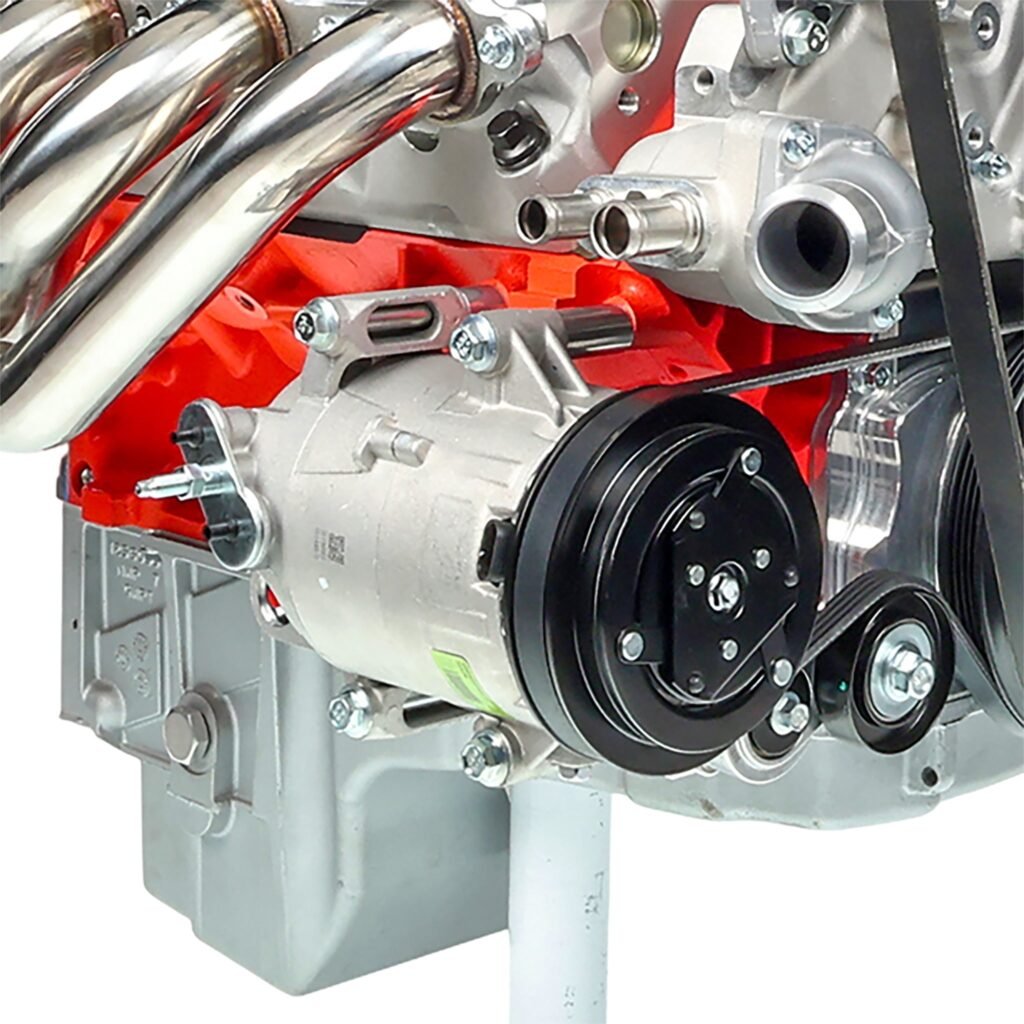 ICT Billet billet A/C compressor bracket installed on an LS engine, holding the stock Corvette compressor with the belt and tensioner